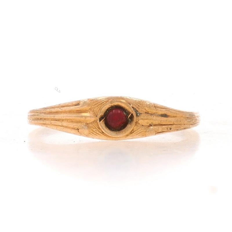 Size: 2

Era: Art Deco
Date: 1920s - 1930s

Metal Content: 10k Yellow Gold

Stone Information
Natural Garnet
Cut: Round Cabochon
Color: Red

Style: Solitaire
Features: Ribbed Shoulder Detailing

Measurements
Face Height (north to south): 5/32