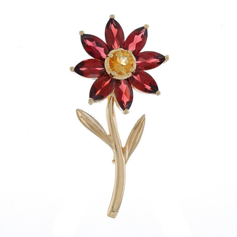 Metal Content: 14k Yellow Gold

Stone Information
Natural Garnets
Carat(s): 3.60ctw
Cut: Marquise
Color: Red

Natural Citrine
Treatment: Heating
Carat(s): .40ct
Cut: Round
Color: Yellow

Total Carats: 4.00ctw

Style: Halo Brooch
Fastening Type: