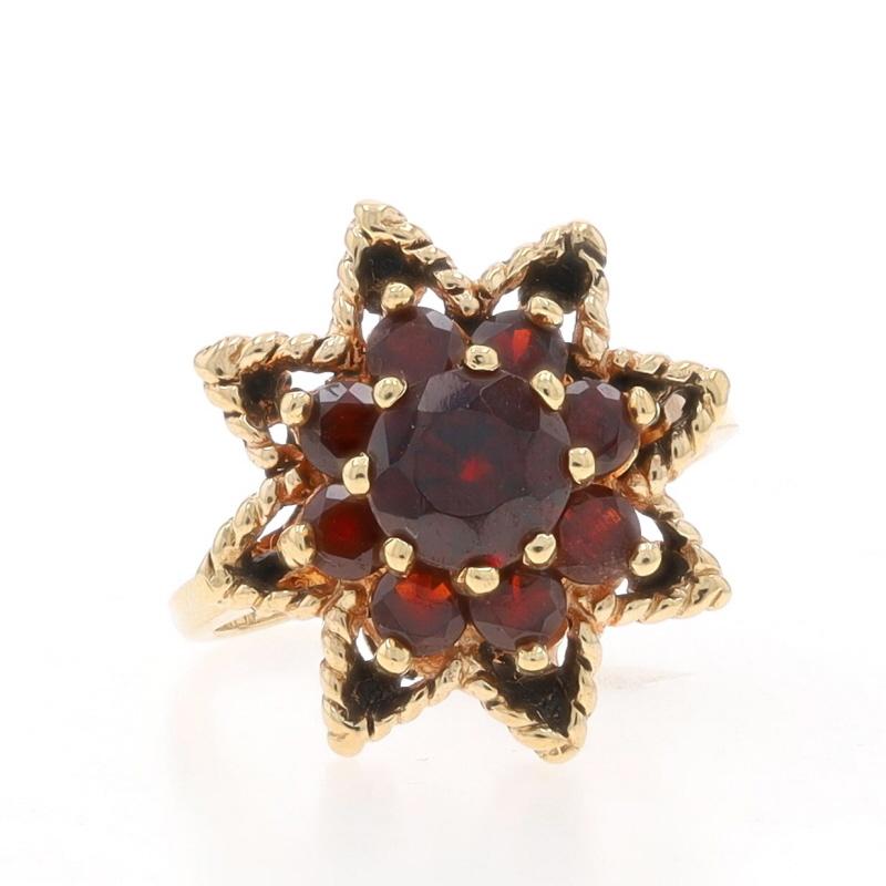 Size: 5
Sizing Fee: Up 2 sizes for $35 or Down 1 size for $25

Metal Content: 10k Yellow Gold

Stone Information

Natural Garnets
Carat(s): 2.04ctw
Cut: Round
Color: Red

Total Carats: 2.04ctw

Style: Cluster Cocktail Halo
Theme: Flower
Features: