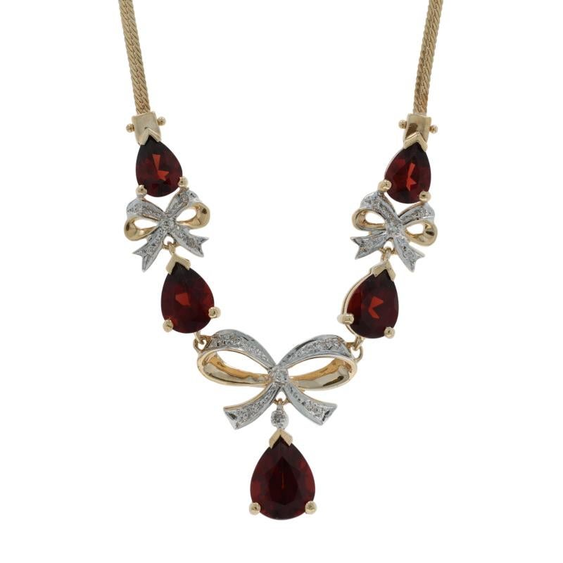 Metal Content: 14k Yellow Gold & 14k White Gold

Stone Information

Natural Garnet
Carat(s): 6.10ctw
Cut: Pear

Natural Diamonds
Carat(s): .07ctw
Cut: Single
Color: H - I
Clarity: SI2 - I1

Total Carats: 6.17ctw

Style: Drop
Necklace Style: