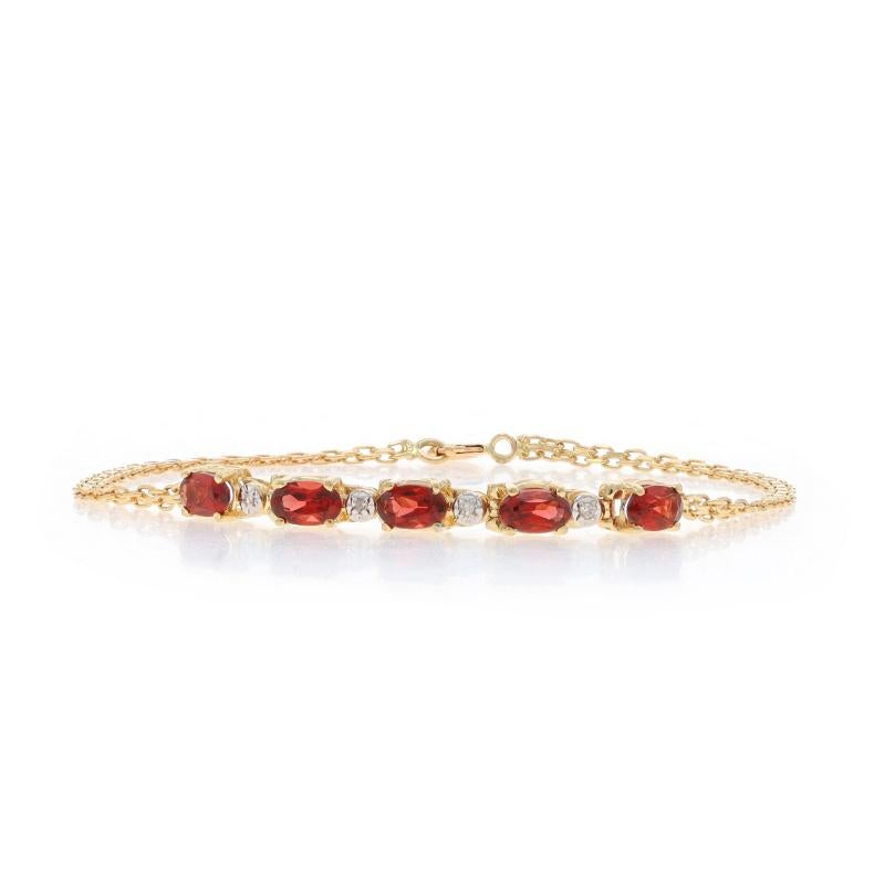 Metal Content: 14k Yellow Gold & 14k White Gold

Stone Information
Natural Garnets
Carat(s): 1.25ctw
Cut: Oval
Color: Red

Natural Diamonds
Cut: Single
Stone Note: (four small accents)

Total Carats: 1.25ctw

Style: Five-Stone with Accents
Chain
