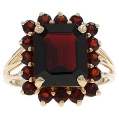 Anello aureola con granato in oro giallo - 10k Smeraldo 9,46ctw