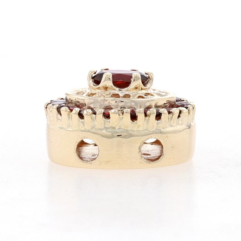 Metal Content: 14k Yellow Gold

Stone Information

Natural Garnets
Carat(s): 1.35ctw
Cut: Oval & Round
Color: Red

Total Carats: 1.35ctw

Style: Halo Solitaire
Theme: Floral
Features: Open cut detailing

Measurements

Tall: 21/32