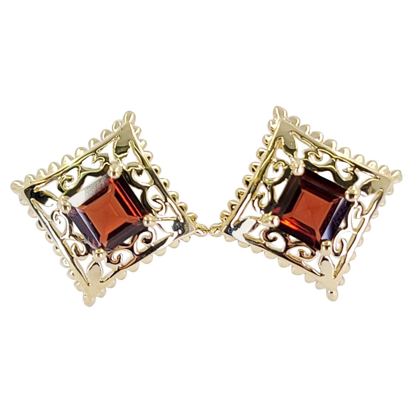 Pendientes de oro amarillo con granate en venta