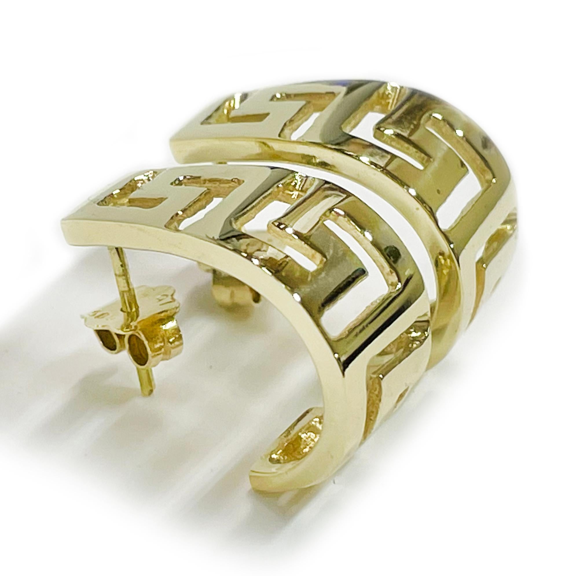 These semi-hoop earrings are crafted in radiant 14 karat yellow gold and feature a bold Greek Key design that adds a touch of timeless sophistication. The intricate pattern wraps along the curved surface of each earring, offering a classic look with
