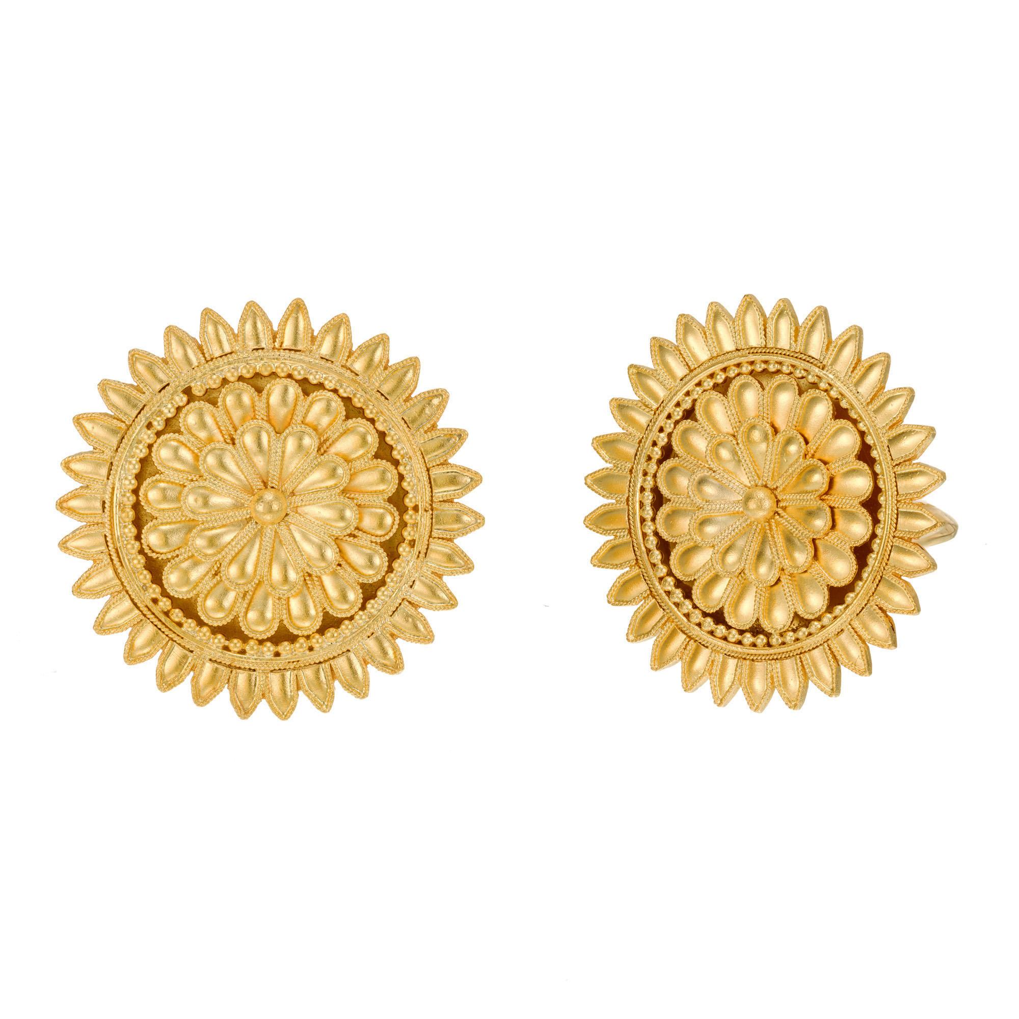 Handmade sunburst design textured Greek clip post 18k yellow gold earrings.

18k yellow gold 
Stamped: 750 Greece
24.0 grams
Top to bottom: 31.8mm or 1.25 Inches
WIdth: 31.7mm or 1.25 Inches
Depth or thickness: 3.9mm
