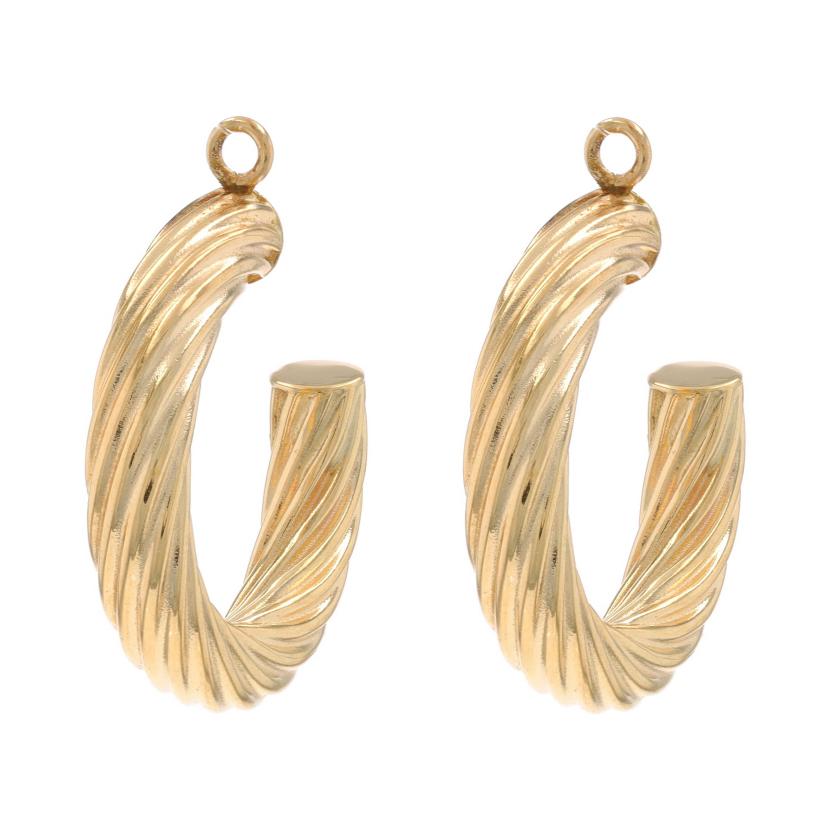 Contenido de metal: Oro amarillo de 14 quilates

Estilo Medio aro
Características: Acanalado

Medidas

Alto: 31/32