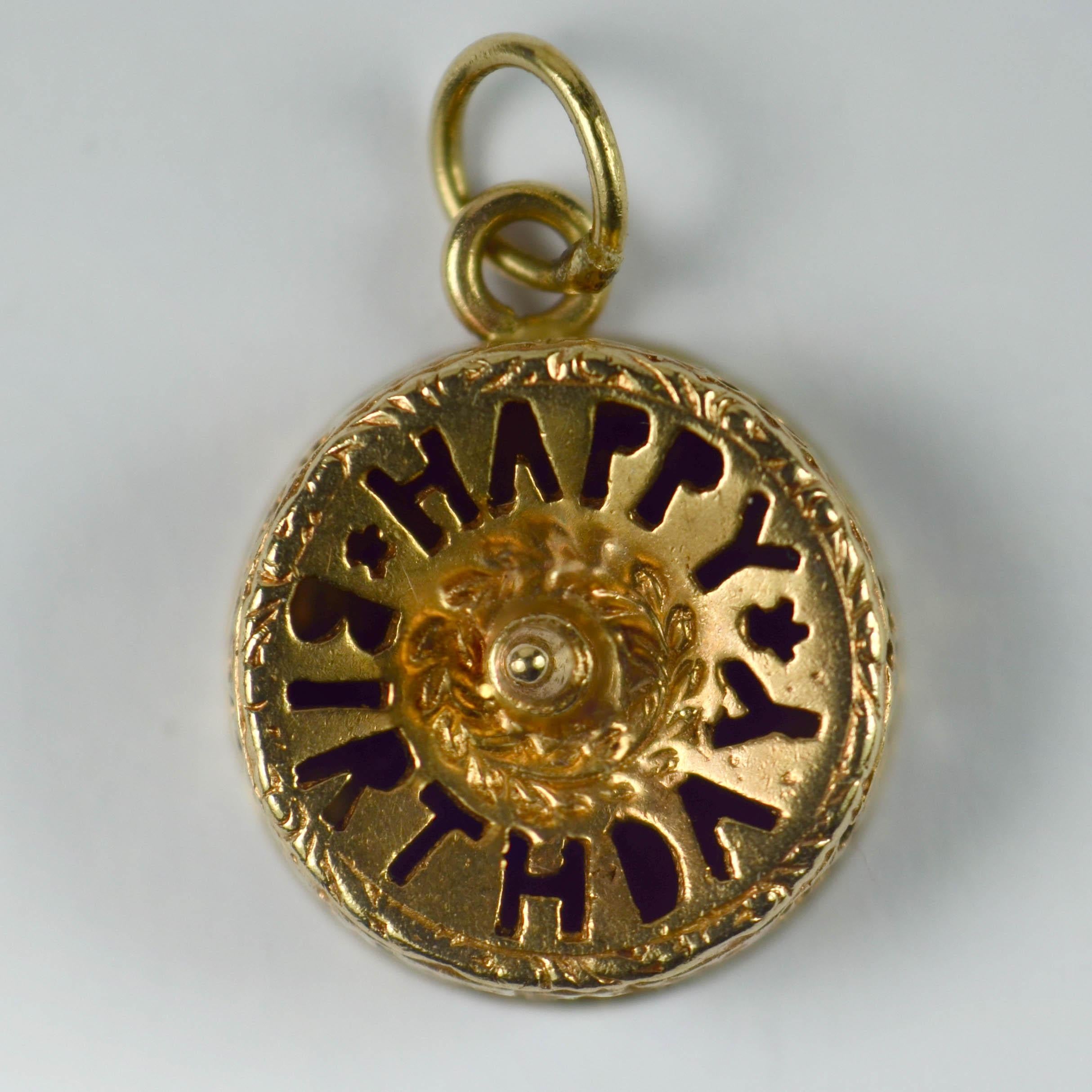 A 14 karat yellow gold charm pendant designed as a birthday cake with candle with the pierced words Happy Birthday to the top and a pierced floral design to the sides.
Marked 14K and copyright AC to the base.

Dimensions: 2 x 1.4 x 1 cm
Weight: 2.47