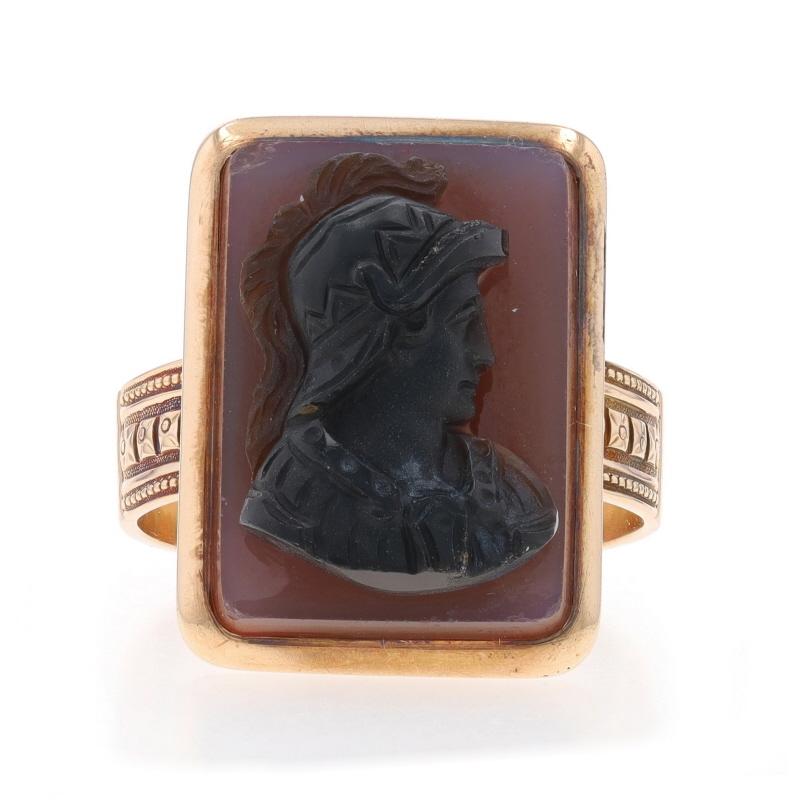 Size: 10 1/2
Sizing Fee: Up 3 sizes for $80 or Down 2 1/2 sizes for $60

Era: Victorian
Date: 1880s - 1890s

Metal Content: 14k Yellow Gold

Stone Information

Natural Hardstone Banded Agate
Cut: Carved Cameo
Color: Black & Reddish Brown
Size: