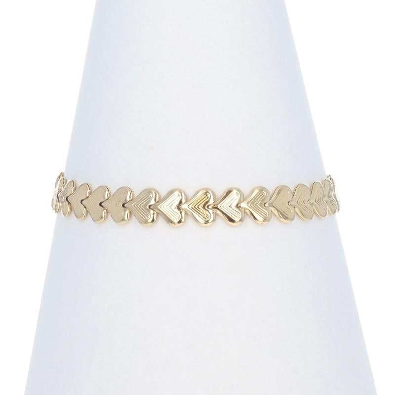 Contenido de metal: Oro amarillo de 14 quilates

Estilo de pulsera: Eslabón
Tipo de cierre: Cierre de pinza de langosta
Tema : Corazon, Amor
Características: Construcción hueca con detalles acanalados

Medidas

Ancho de la cadena: 9/32