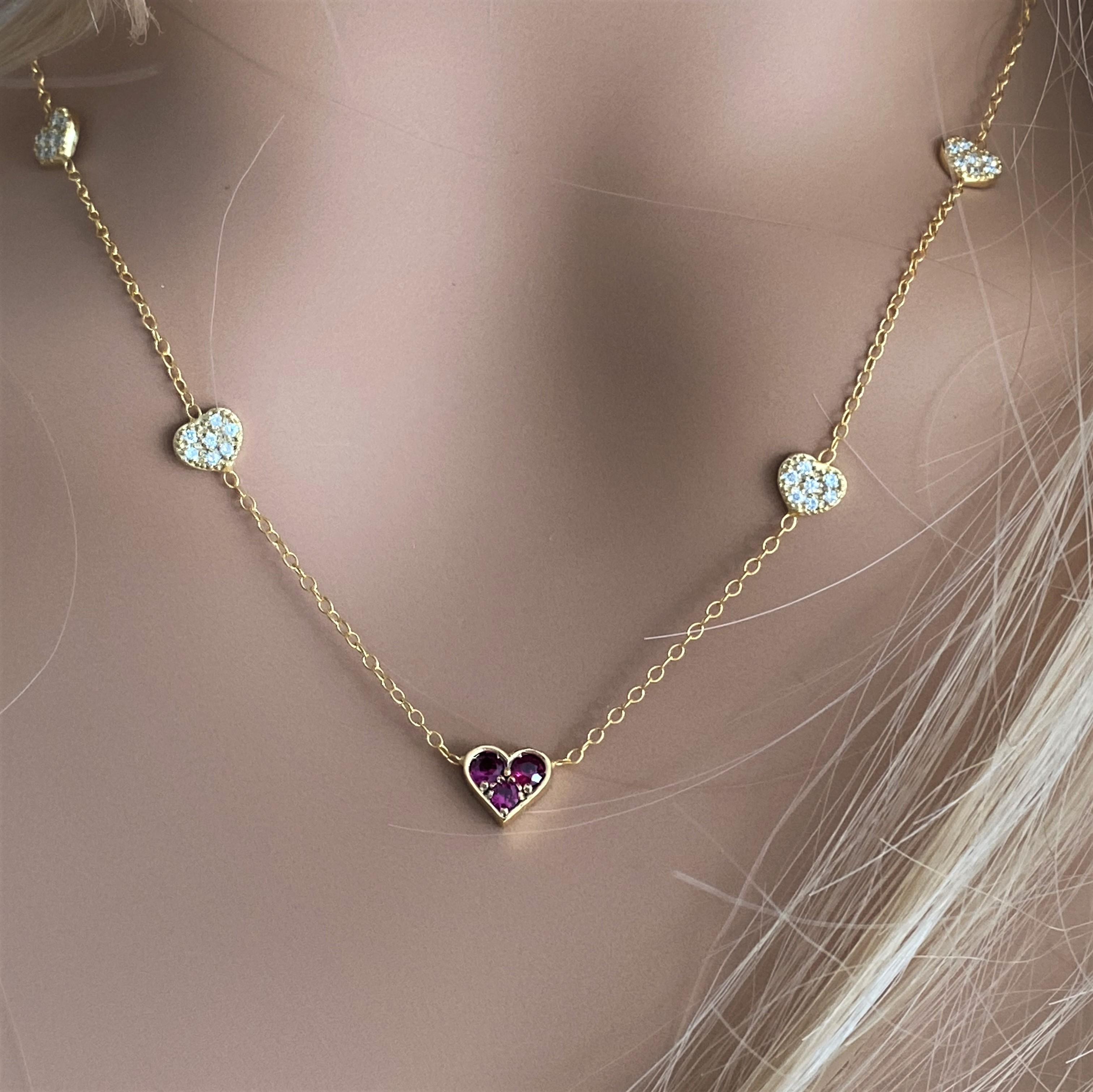 Yellow Gold Heart Shaped Ruby and Four Diamond Heart Charm Pendant In New Condition In New York, NY