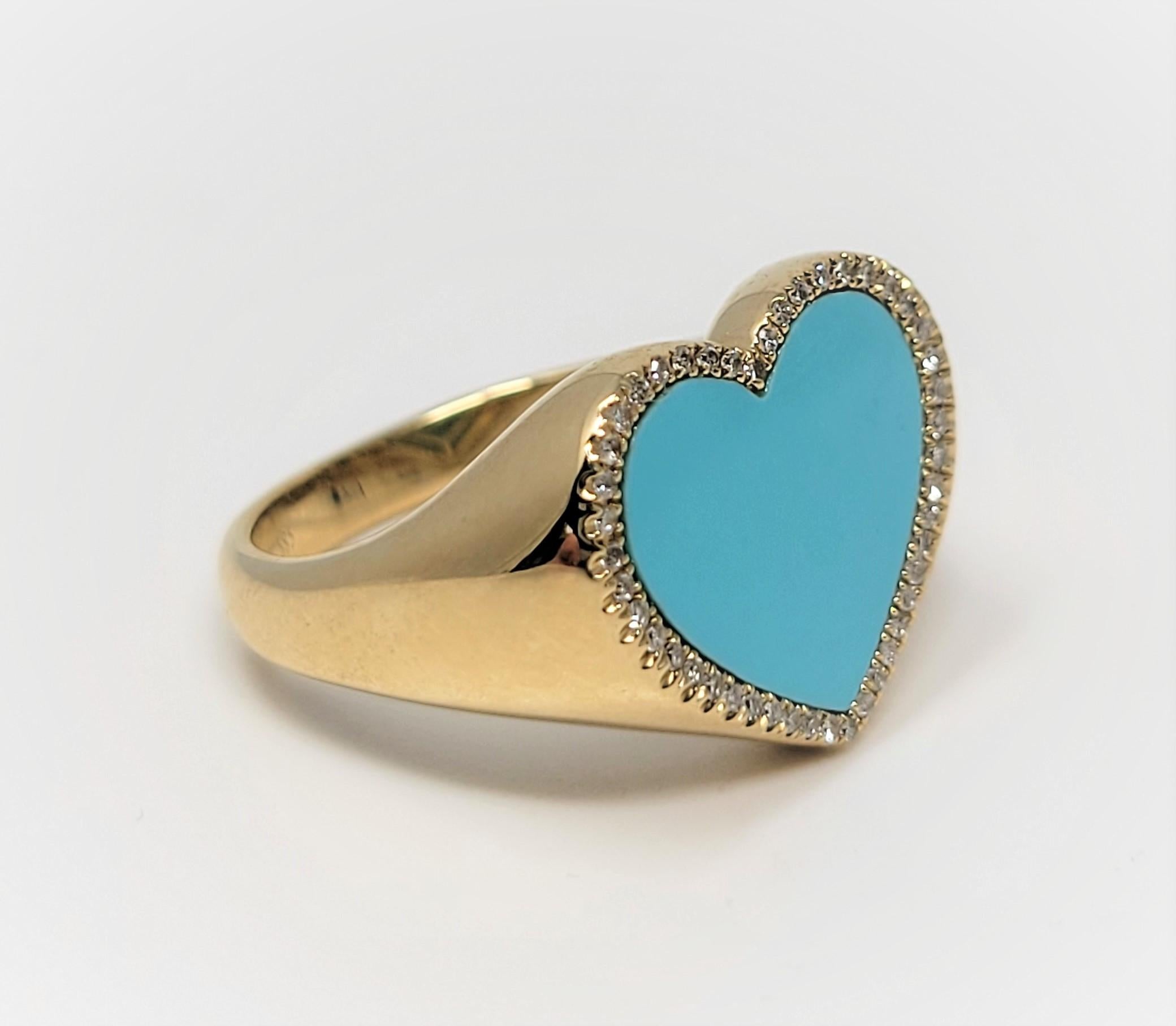 In 14 karat yellow gold, this ring supports a heart-shaped turquoise center, which is surrounded by round diamonds.  Great addition to your jewelry collection!