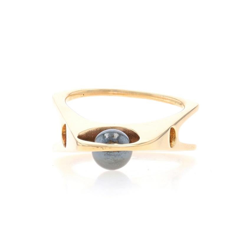 Size: 6 1/2
Sizing Fee: Up 1 size for $50 or Down 1 size for $50

Metal Content: 14k Yellow Gold

Stone Information
Natural Hematite
Color: Grey
Diameter: 6.2mm

Style: Solitaire
Theme: Abstract
Features: Euro Shank

Measurements
Face Height (north