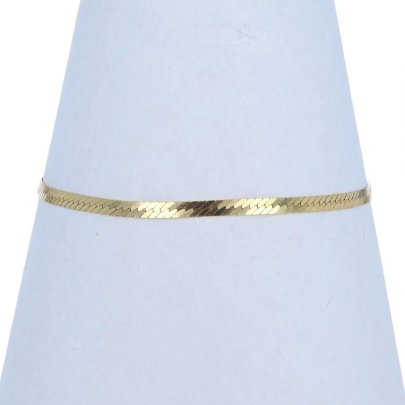 Metal Content: 14k Yellow Gold

Chain Style: Herringbone
Bracelet Style: Chain
Fastening Type: Spring Ring Clasp

Measurements

Length: 6 3/4
