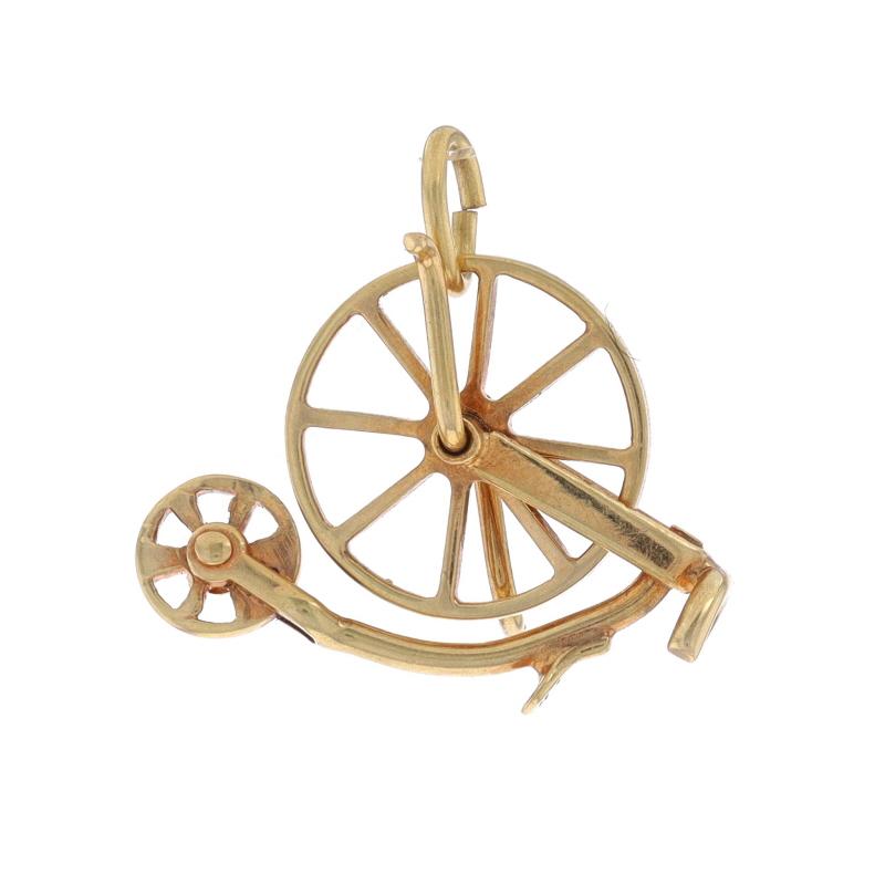 Metal Content: 14k Yellow Gold

Theme: High Wheel Bicycle, Penny Farthing
Features: Rotating front wheel

Measurements

Tall: 9/16