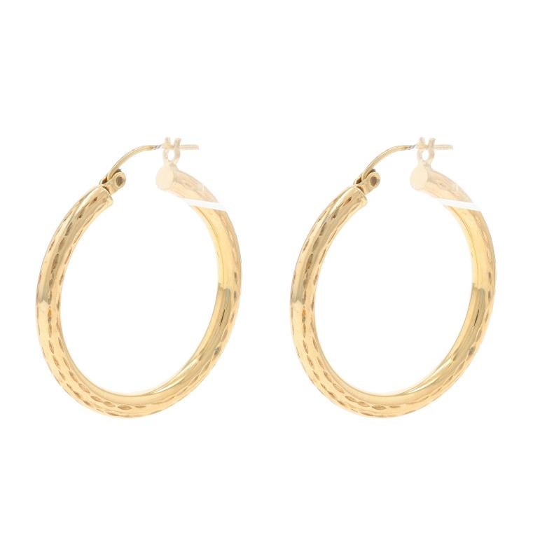 Metal Content: 10k Yellow Gold

Style: Hoop
Fastening Type: Snap Closures
Features: Etched Detailing, Hollow Construction for Comfort During Wear

Measurements

Tall: 1 9/32