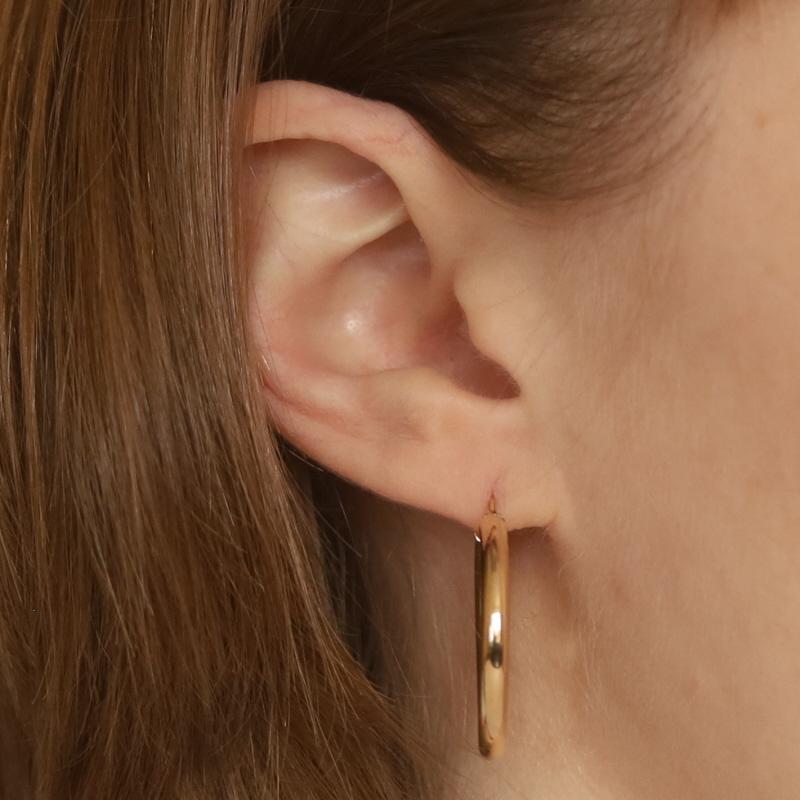 Metal Content: 14k Yellow Gold

Style: Hoop
Fastening Type: Snap Closures
Features: Hollow construction for comfortable, all-day wear

Measurements
Tall: 1 3/32