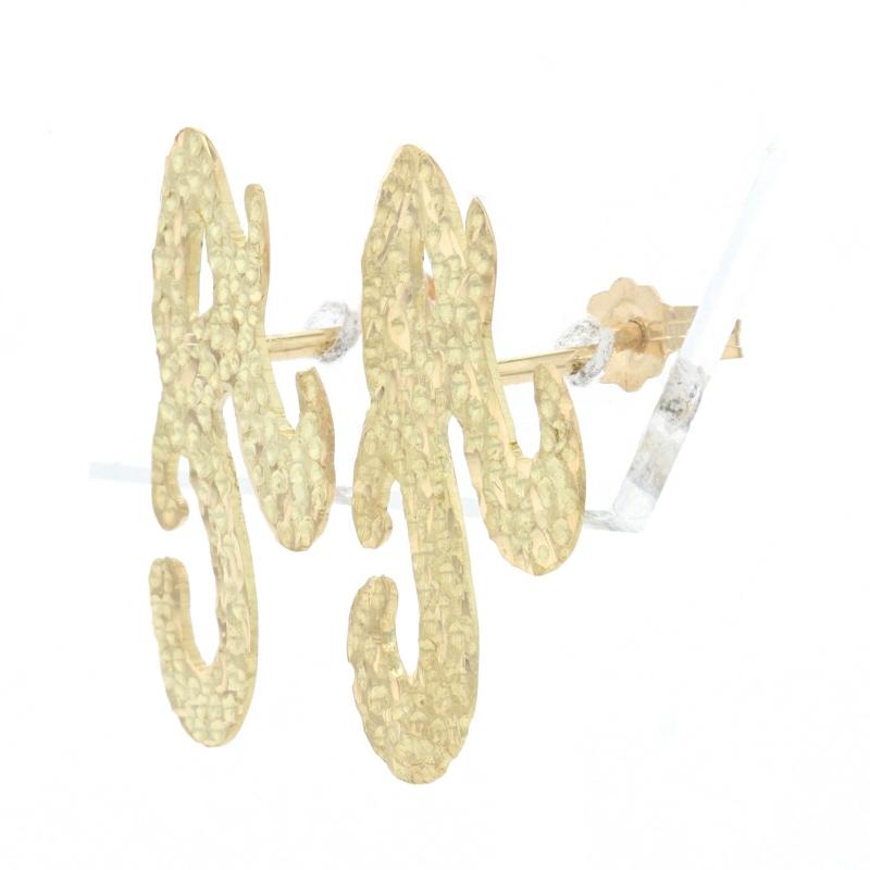 Metal Content: 18k Yellow Gold 

Style: Large Stud 
Fastening Type: Butterfly Closures 
Theme: Initial A Script Monogram Letter
Features: Smooth & Matte Finishes with Etched Detailing

Measurements: 
Tall: 5/8