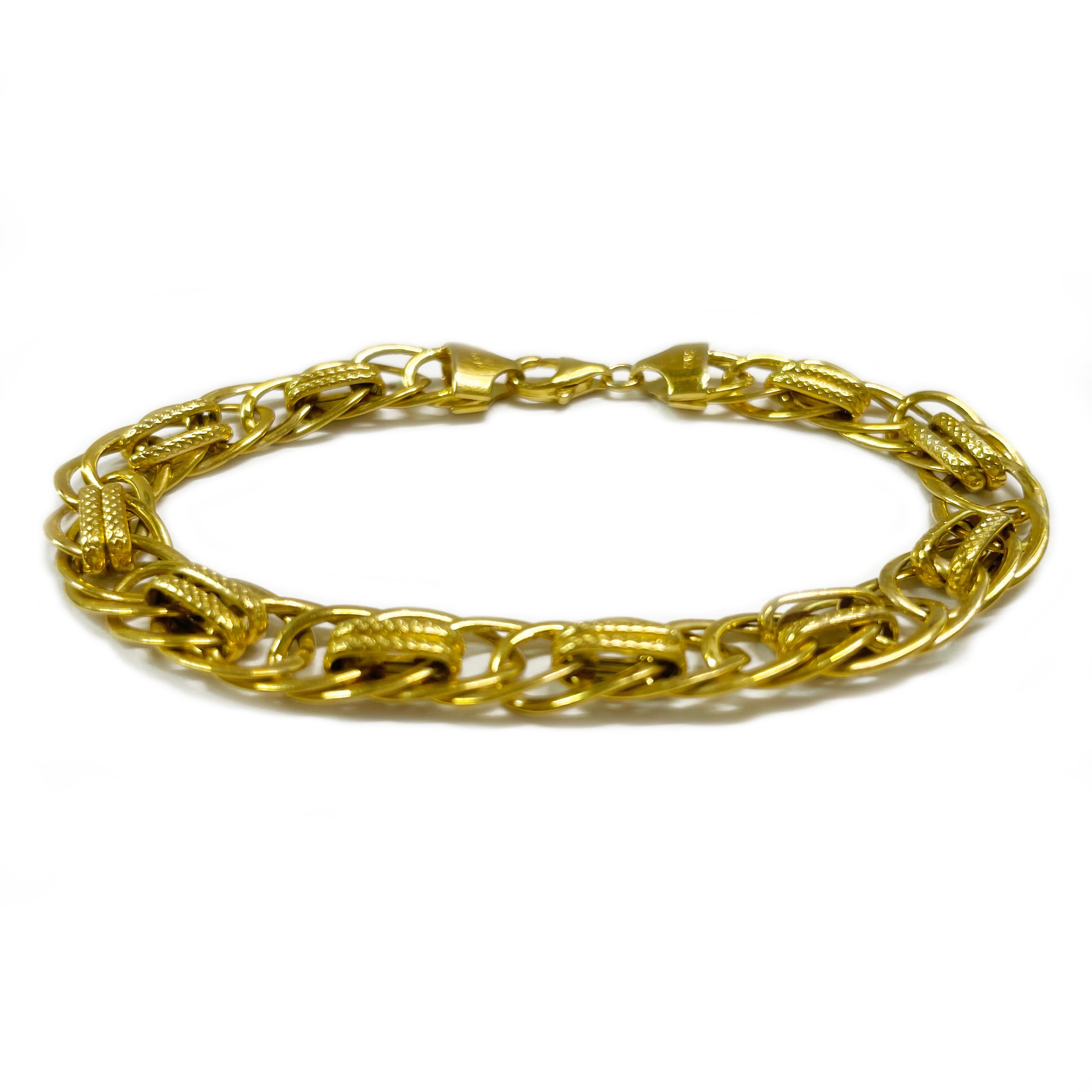 14 Karat Yellow Gold Interlocking Curb Link Bracelet. The hollow lightweight bracelet features oval links with ten textured dual links. The bracelet is 8.5mm wide and 7