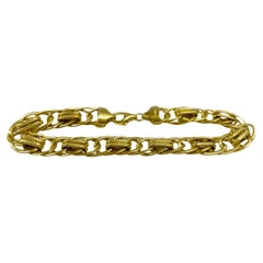 Bracelet en or jaune à maillons de bordure entrelacés