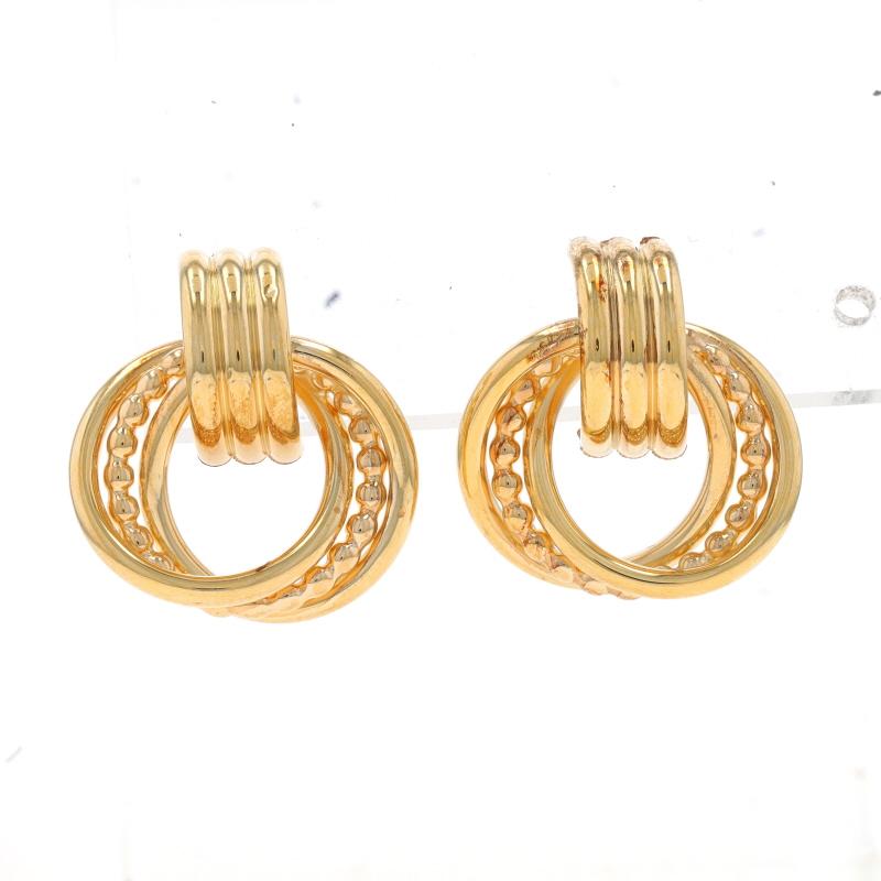 Metal Content: 14k Yellow Gold

Style: Drop
Fastening Type: Butterfly Closures
Theme: Intertwined Circles

Measurements
Tall: 7/8