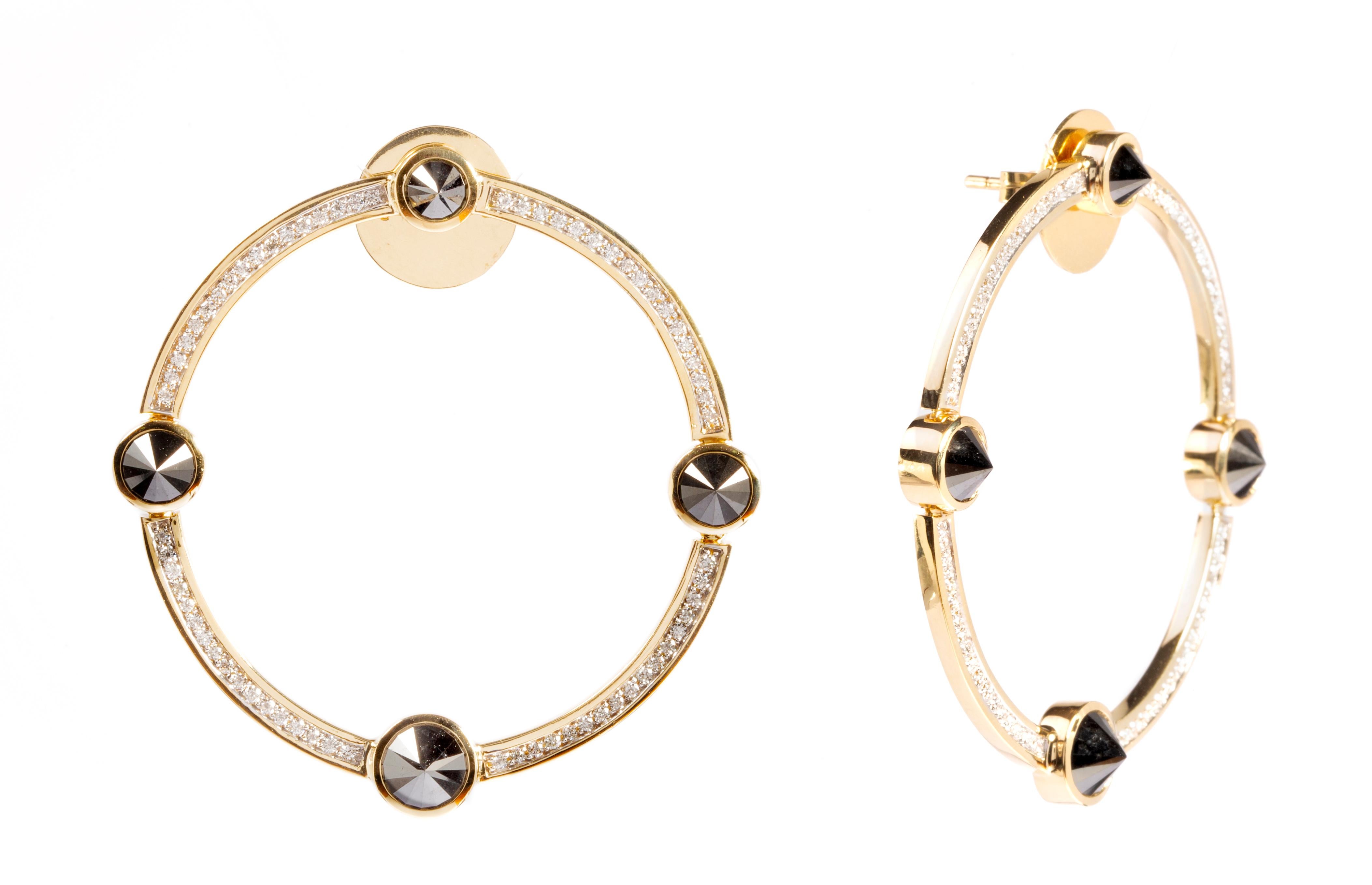 Designed exclusively by Ara Vartanian, these circular designed earrings have been created in 18k Yellow Gold, adorned by eight Black Diamonds in a round brilliant cut, with a total weight of 5,58ct (five carats and fifty-eight points), at the shape