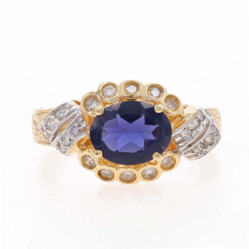 Size: 7
Sizing Fee: Up 2 sizes for $35 or Down 1 size for $35

Metal Content: 14k Yellow Gold & 14k White Gold

Stone Information

Natural Iolite
Carat(s): 1.10ct
Cut: Oval
Color: Purple

Natural Diamonds
Carat(s): .25ctw
Cut: Round Brilliant
Color:
