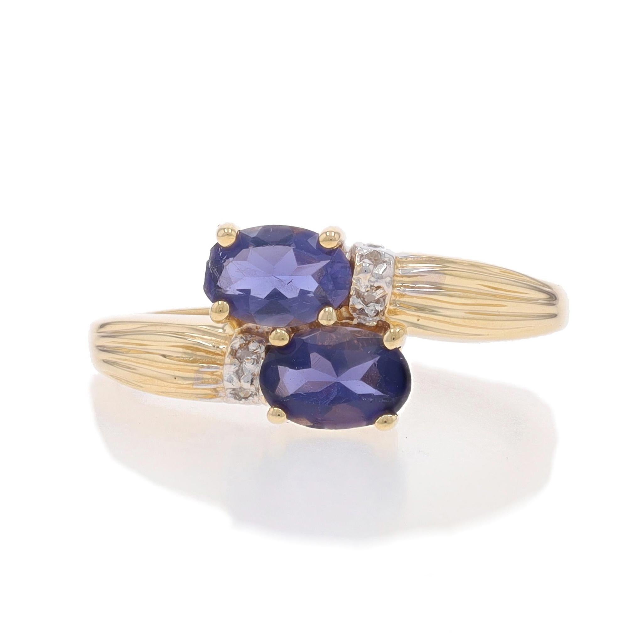 Size: 7 1/4
Sizing Fee: Up 2 sizes for $35 or Down 1 size for $25

Metal Content: 14k Yellow Gold & 14k White Gold

Stone Information

Natural Iolites
Carat(s): .58ctw
Cut: Oval
Color: Purple

Natural Diamonds
Cut: Single
Stone Note: (four small