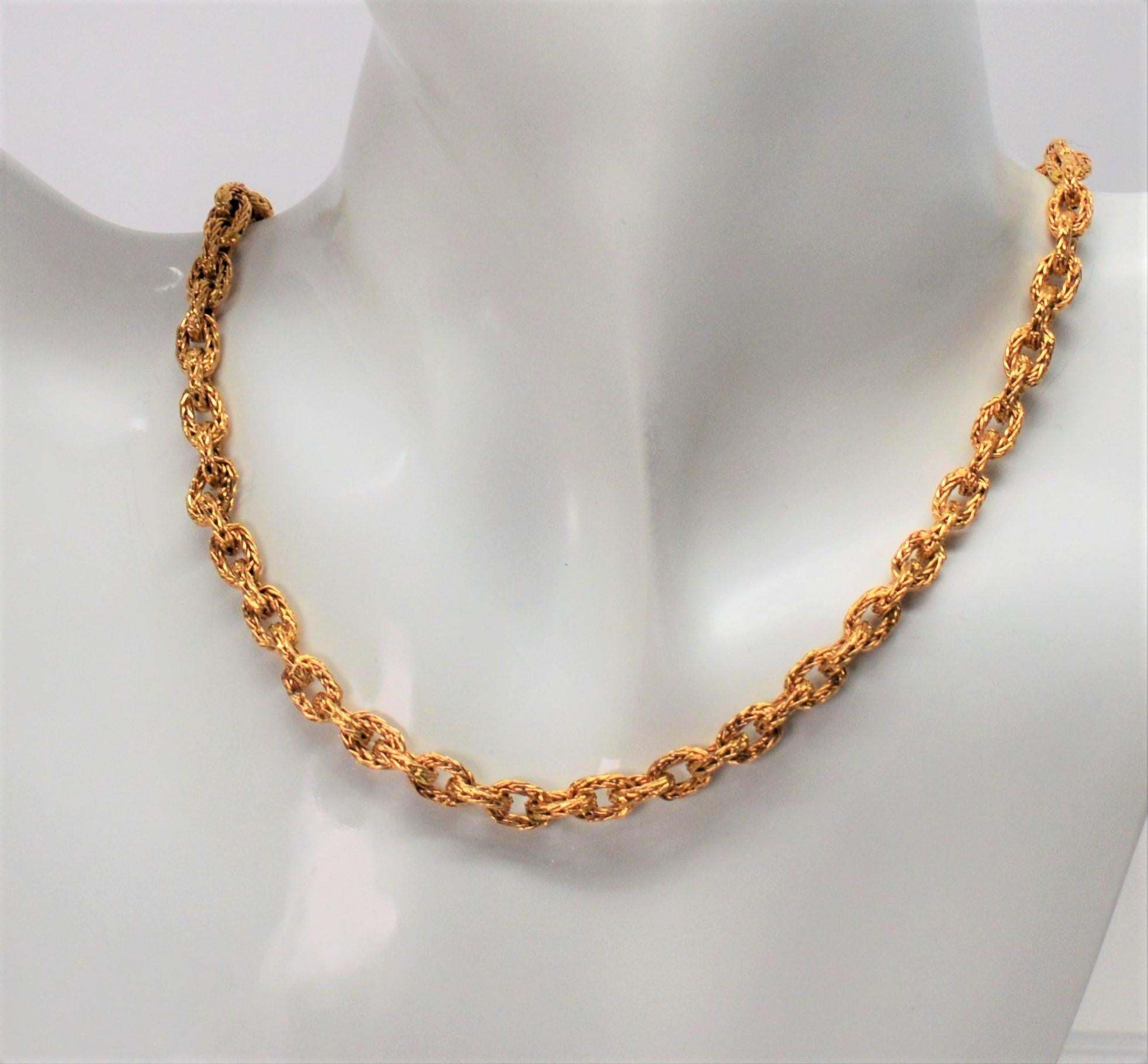 Quality Italian craftsmanship is displayed in this fine necklace of unique and individually hand woven oval wire links in bright eighteen karat  18K yellow gold.  It's rustic texture is the outstanding feature and creates interest along this sixteen