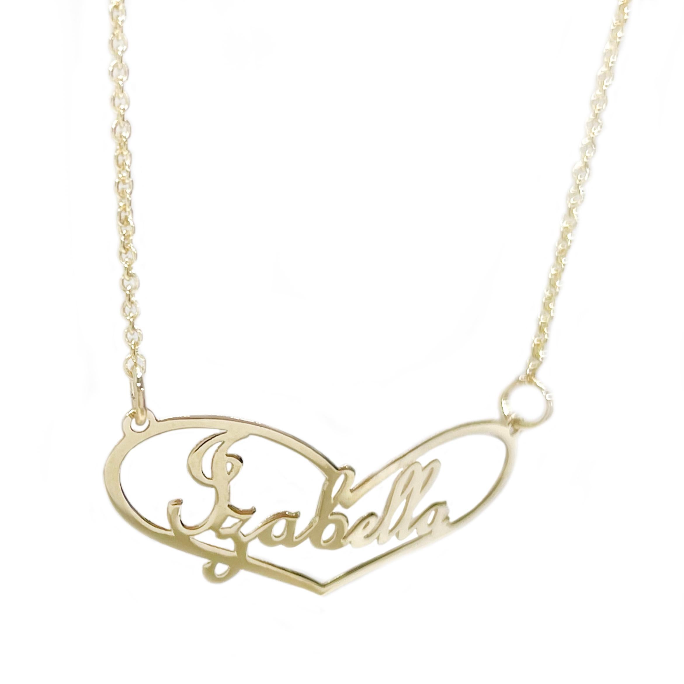 10 Karat Yellow Gold Izabella Name Pendant Necklace. The necklace features an elongated heart shape pendant with the name Izabella inside the heart in a cursive font. The chain is 18