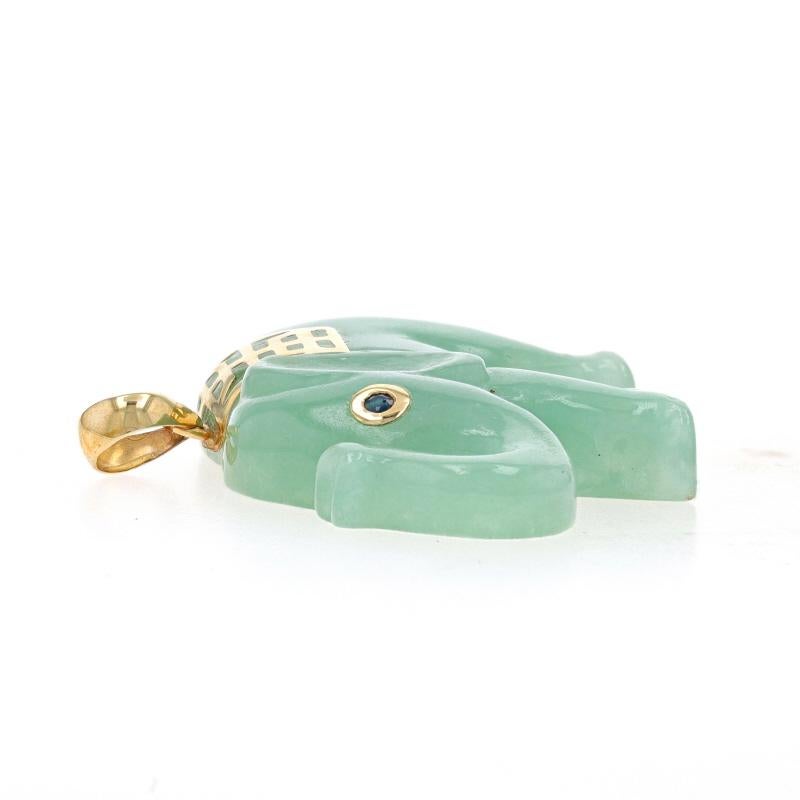 Metal Content: 14k Yellow Gold

Stone Information
Natural Jade
Treatment: Routinely Enhanced
Cut: Carved
Color: Green

Natural Sapphire
Treatment: Heating
Carat(s): .03ct
Cut: Round
Color: Blue

Theme: Walking Elephant, Shou