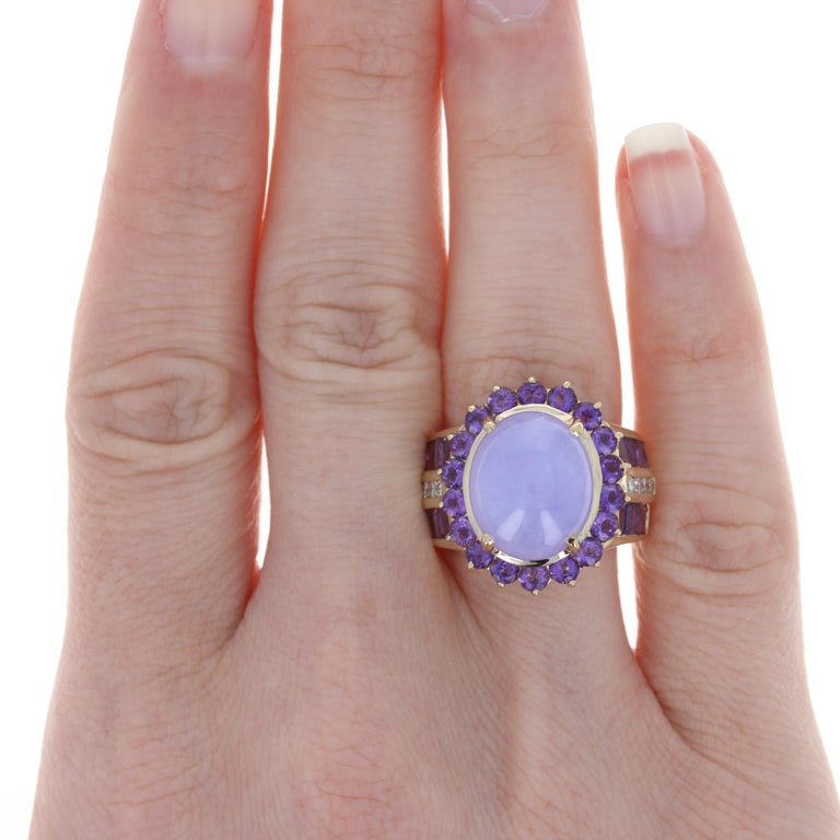Size: 5 3/4

Metal Content:14k Yellow Gold

Stone Information: 
Genuine Jadeite
Treatment: Not Treated
Carat: 8.50ct
Cut: Cabochon
Color: Purple
Size: 13.7mm x 11.4mm

Genuine Amethysts
Carats: 3.44ctw
Cut: Round & Rectangular
Color: Purple

Natural