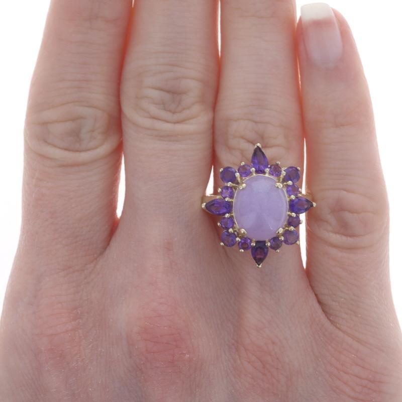 Size: 7 1/4
Sizing Fee: Up 2 sizes for $35 or Down 1 size for $35

Metal Content: 14k Yellow Gold

Stone Information
Natural Jadeite
Treatment: Routinely Enhanced
Carat(s): 6.45ct
Cut: Oval Cabochon
Color: Lavender

Natural Amethysts
Carat(s):