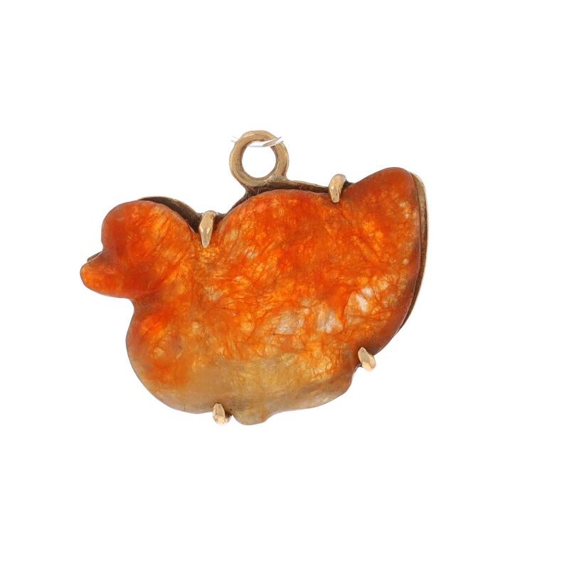 Metal Content: 14k Yellow Gold

Stone Information
Natural Jadeite
Treatment: Routinely Enhanced
Cut: Carved
Color: Orange

Theme: Duck, Bird, Waterfowl

Measurements
Tall (from stationary bail): 9/16
