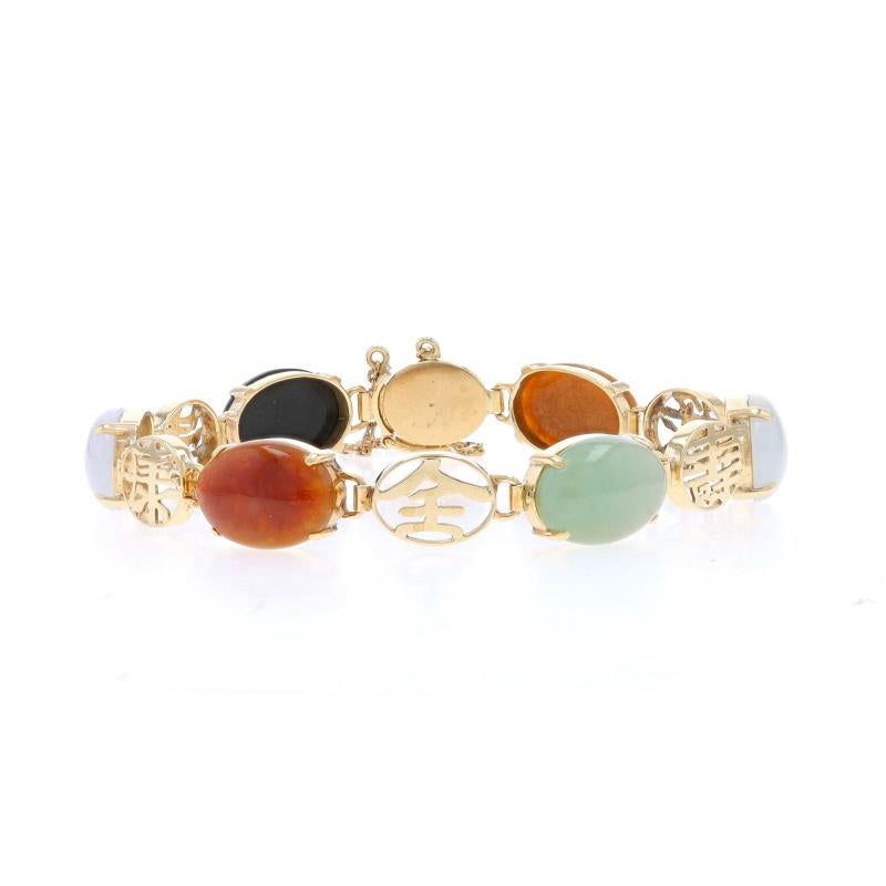 Contenu du métal : Or jaune 14k

Informations sur les pierres
Jadéite naturelle
Traitement : Amélioration de routine
Coupe : Cabochon ovale
Couleur : vert, blanc, violet clair et orange-tan.

Onyx naturel
Coupe : Cabochon ovale
Couleur : Noir

Style