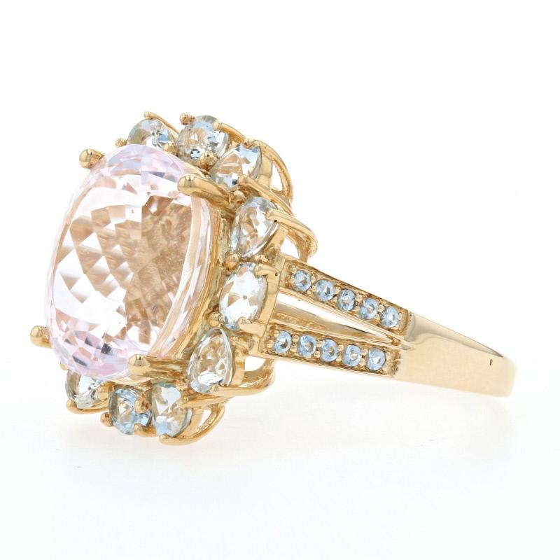 If you're dreaming of something sweet and sparkling, this exceptional piece will be a wonderful addition to your collection! This halo ring showcases a shimmering Kunzite solitaire beautifully accompanied by icy blue topaz accents set in 14k yellow