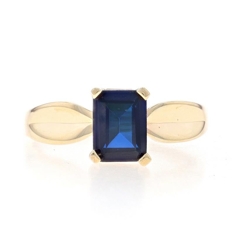 Size: 9 1/4
Sizing Fee: Up 2 sizes for $35 or Down 4 sizes for $30

Metal Content: 10k Yellow Gold

Stone Information
Synthetic Sapphire
Carat(s): 1.75ct
Cut: Emerald
Color: Blue

Total Carats: 1.75ct

Style: Solitaire
Features: Contoured