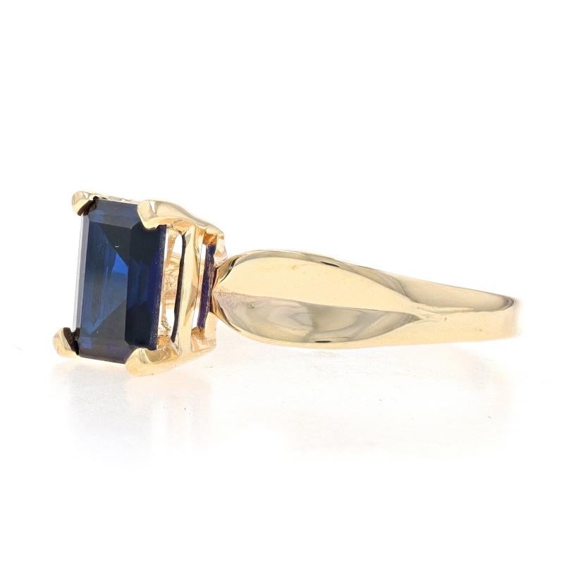 Women's Yellow Gold Lab-Created Sapphire Solitaire Ring - 10k Emerald Cut 1.75ct For Sale