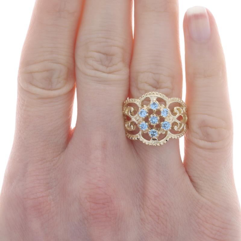 Size: 7 1/2
Sizing Fee: Up 2 sizes for $40 or Down 2 sizes for $35

Metal Content: 14k Yellow Gold

Stone Information
Synthetic Spinel
Carat(s): .56ctw
Cut: Round
Color: Blue

Total Carats: .56ctw

Style: Cluster Cocktail
Theme: Floral
Features:
