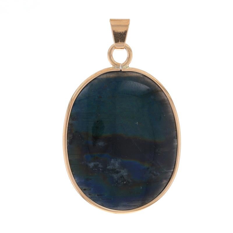 Metal Content: 14k Yellow Gold

Stone Information
Natural Labradorite
Cut: Oval Double Sided Cabochon

Style: Solitaire

Measurements
Tall (from stationary bail): 1 7/16