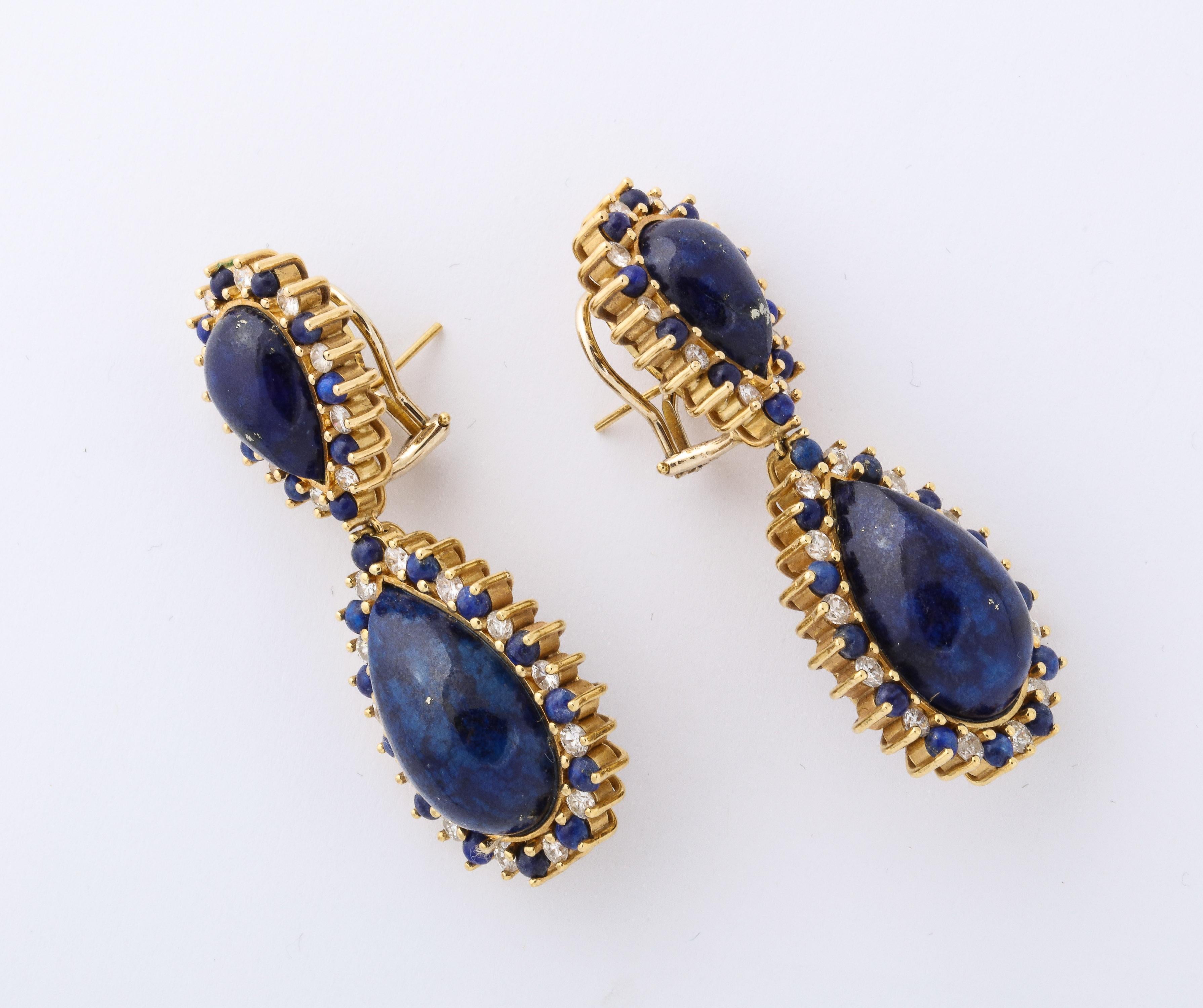 Sexy & voluptuous Lapis & full cut 7 clean white Diamond Drop Earrings.  Pear Shaped Lapis Lazuli  surrounded by alternating Lapis Bead & full cut Diamonds.  Approximate Diamond weight is 1carat.  Handmade -what a look!.  Adapted for pierced but