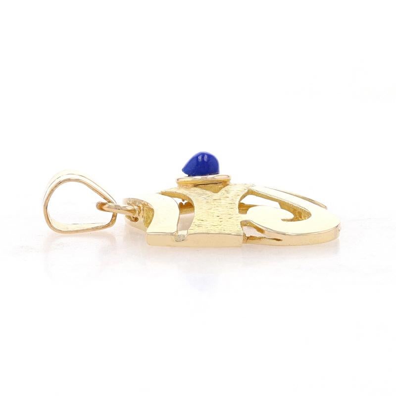 Metal Content: 18k Yellow Gold

Stone Information

Natural Lapis Lazuli
Cut: Round Cabochon
Color: Blue

Theme: Eye of Horus, Egyptian Mythology Protection
Features: Smoothly Finished with Etched Detailing

Measurements

Tall (from stationary bail):