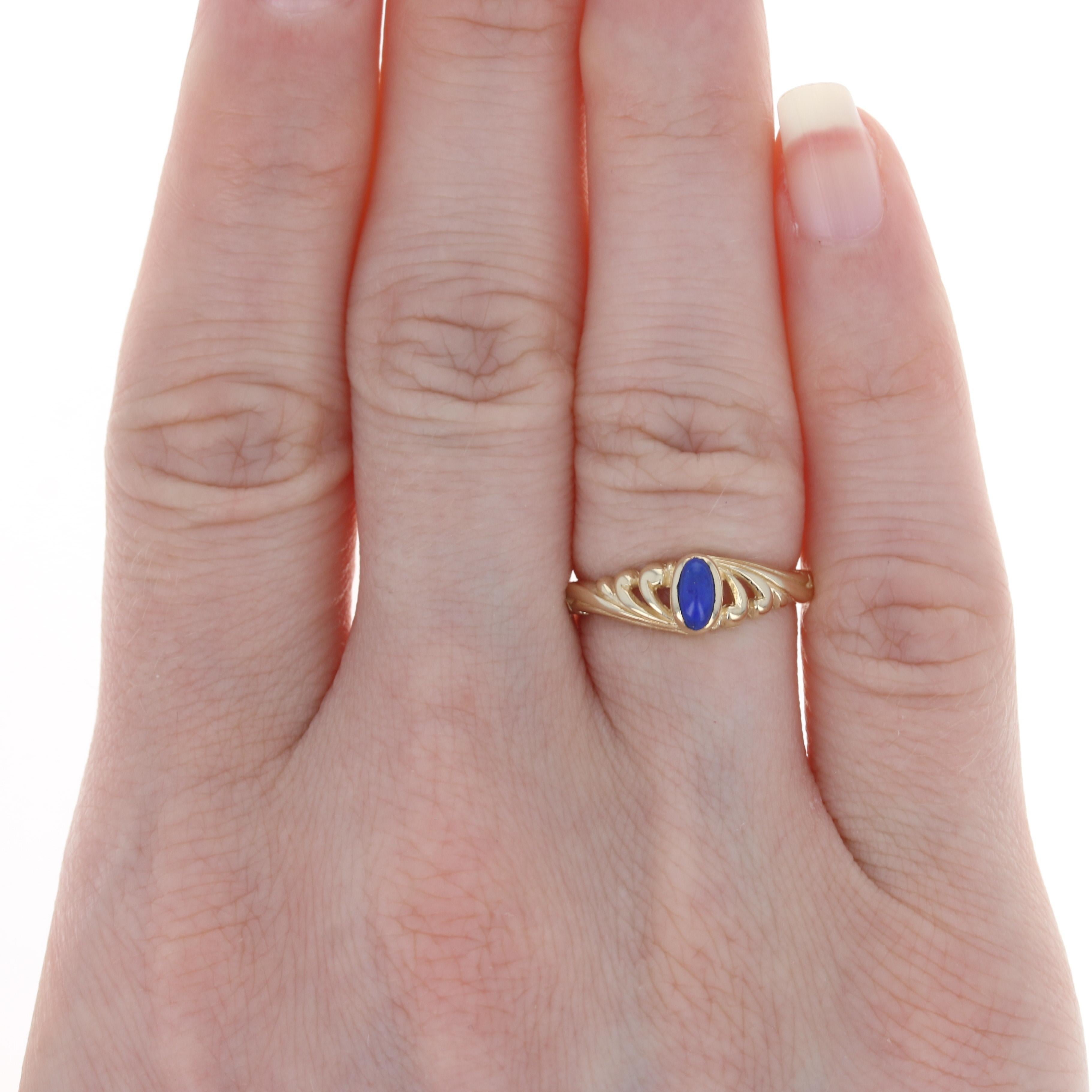 Size: 5 1/4
 Sizing Fee: Down 2 sizes for $20 or up 2 sizes for $25
 
 Metal Content: 14k Yellow Gold
 
 Stone Information: 
 Genuine Lapis Lazuli
 Color: Blue
 
 Style: Solitaire
 Features: Open Cut Detailing
 
 Face Height (north to south): 1/4