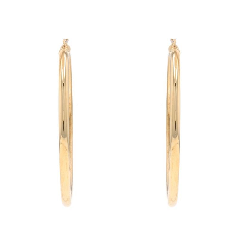 Metal Content: 14k Yellow Gold

Style: Large Hoop
Fastening Type: Snap Closures
Features: Hollow construction for comfortable, all-day wear

Measurements

Tall: 2 1/32