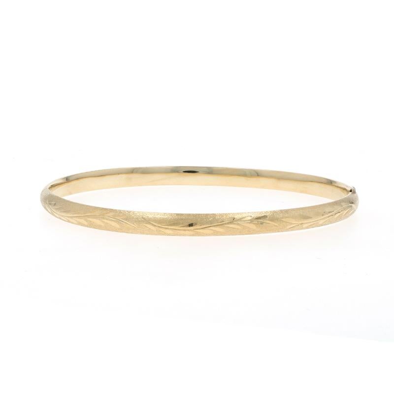 Metal Content: 14k Yellow Gold

Bracelet Style: Bangle
Fastening Type: Slide Clasp
Theme: Leaf Garland
Features: Hollow Construction with Textured Detailing

Measurements

Inner Circumference: 6 3/4