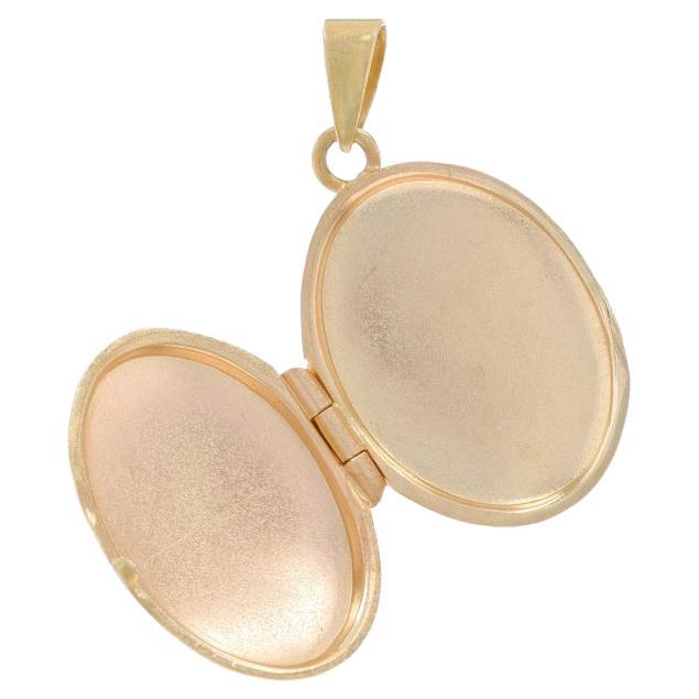 Pendentif médaillon ovale en forme de feuille en or jaune 14 carats avec deux cadres, Italie