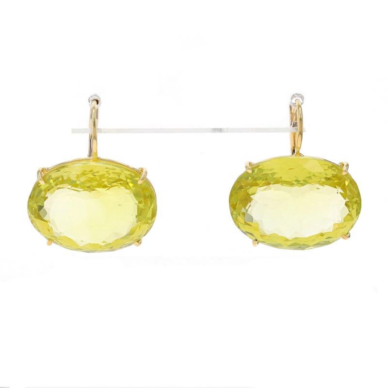 Metal Content: 18k Yellow Gold

Stone Information
Natural Quartz
Carat(s): 9.38ctw
Cut: Oval
Color: Lemon Lime

Total Carats: 9.38ctw

Style: Drop
Fastening Type: Leverback Closures

Measurements
Tall: 31/32