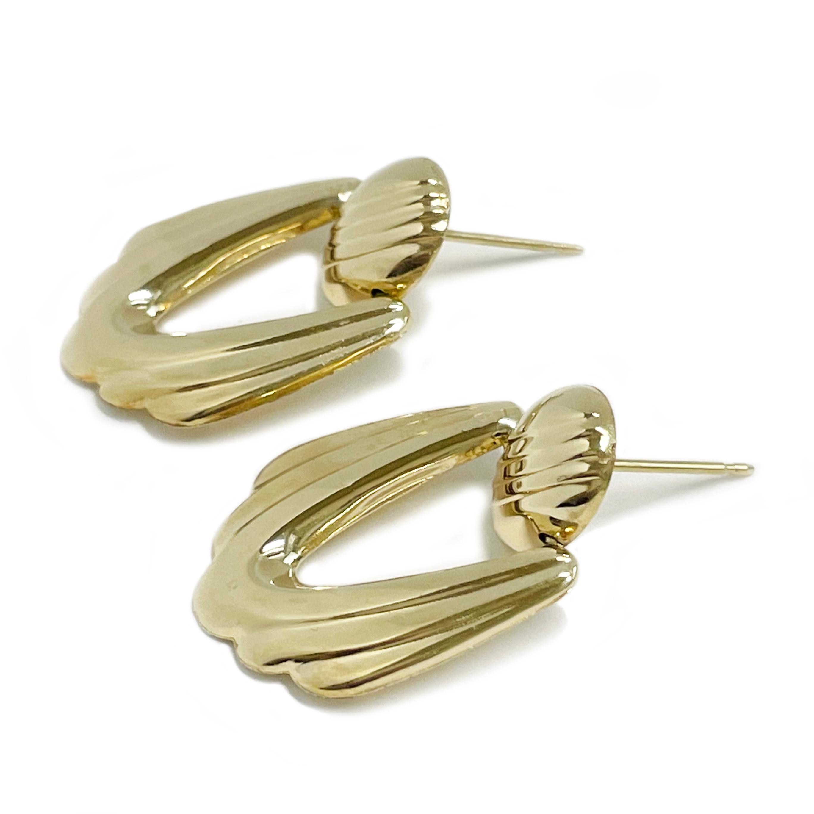 Crafted in 14K yellow gold, these lightweight scalloped earrings offer both elegance and versatility. Designed to dangle and sway gracefully, they add a subtle yet eye-catching touch to any outfit. Perfect for both casual and formal wear, these