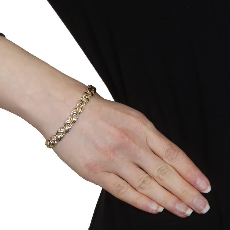 Metal Content: 14k Yellow Gold

Style: Link
Fastening Type: Tab Box Clasp with One Side Safety Clasp
Theme: Leaf Braid, Mushrooms
Features: Smoothly Finished Hollow Links with Brushed Detailing

Measurements

Length: 7 1/4