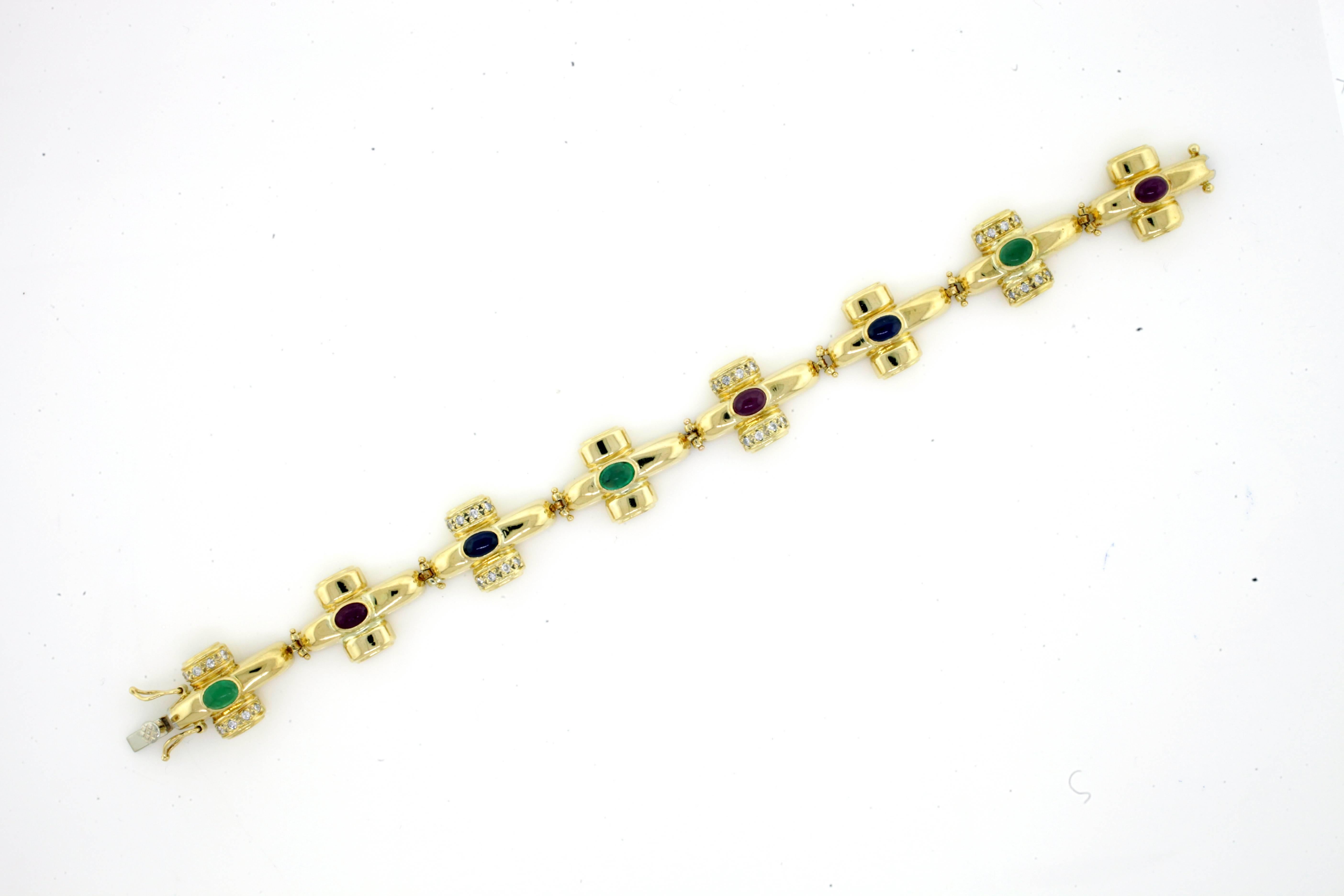 A tasteful and colorful combination of precious materials is employed in fabulous fashion in this enchanting bracelet.
Vintage Bracelet XOX Links Ruby Emerald Sapphire Cabochons Gold Bracelet.
Length: 7 inches
Width: 0.5 inches
